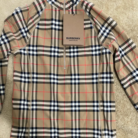 Burberry Tops - Small Burberry turtleneck blouse. New season.